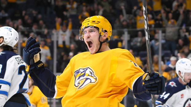 Nashville Predators left wing Tanner Jeannot (84) scores against the Winnipeg Jets during the third period at Bridgestone Arena